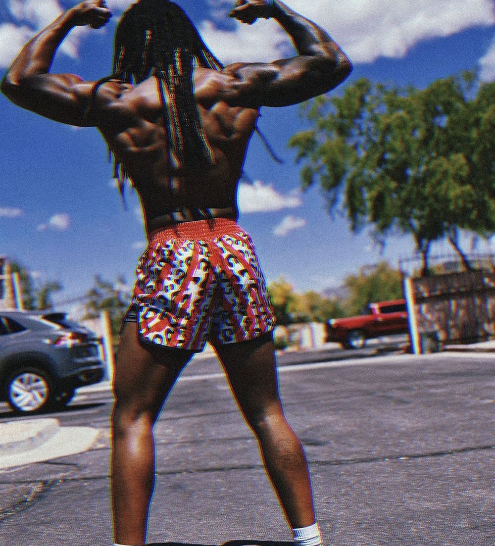 Stacey from behind, flexing