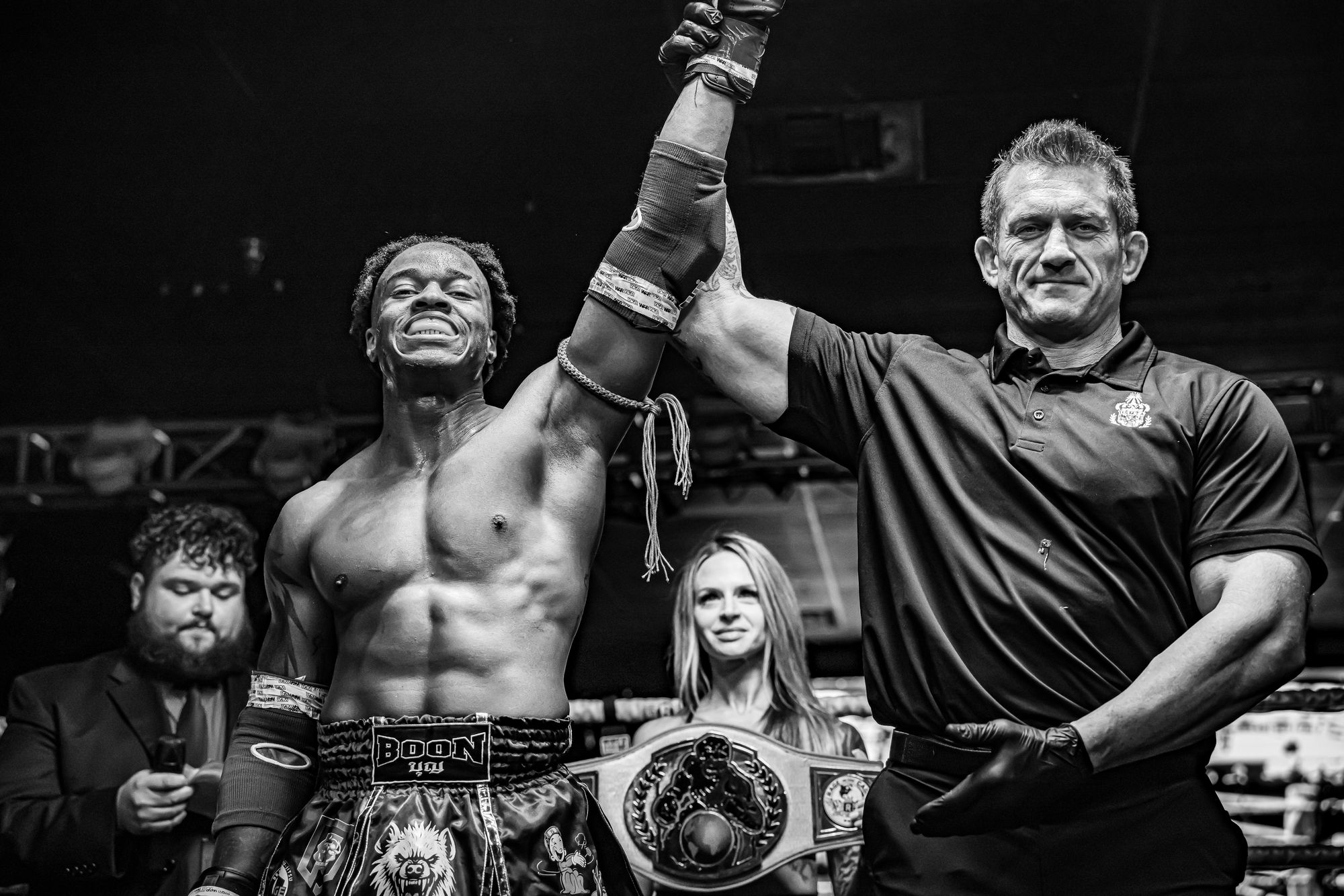 Stacey smiling as the referee raises his hand