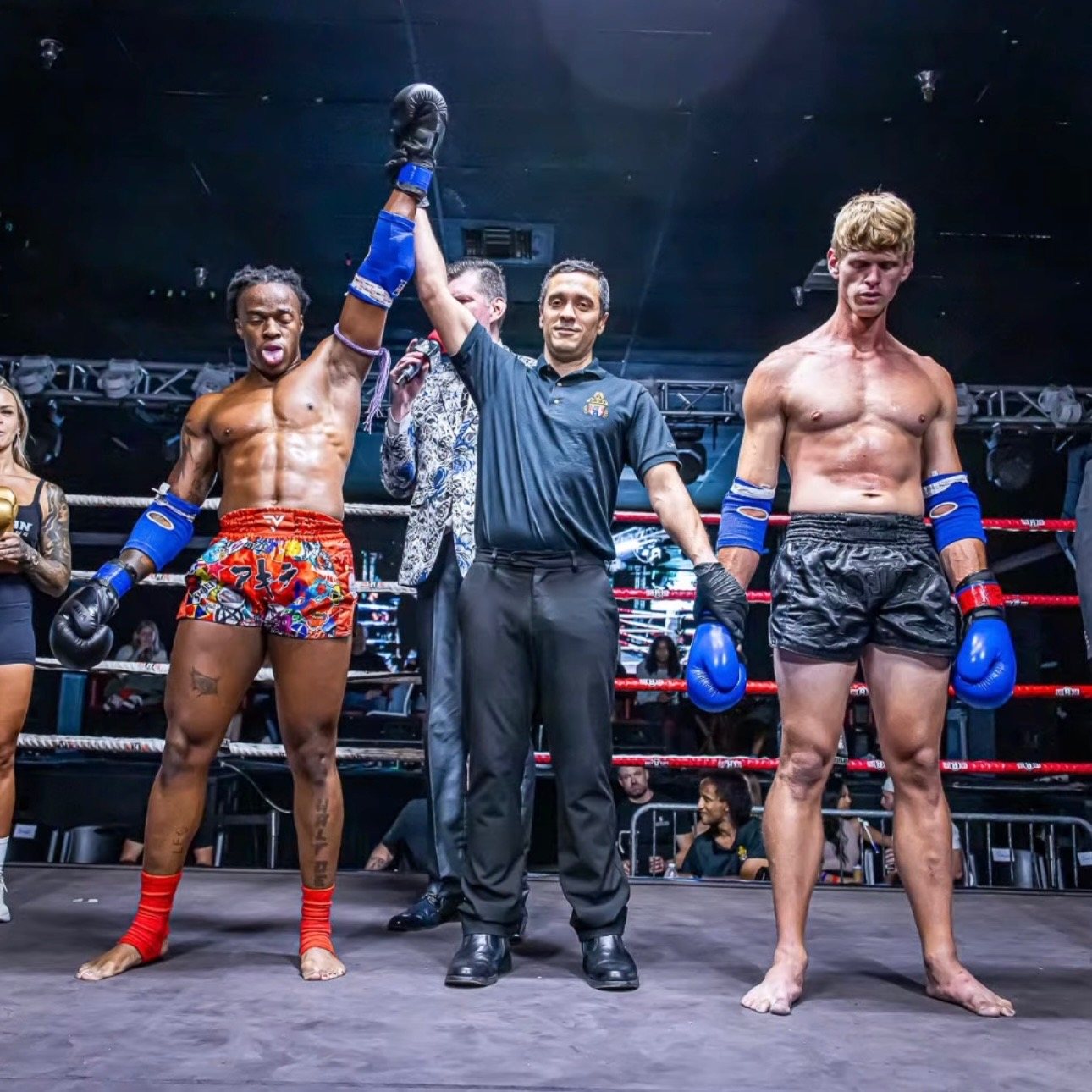 Stacey's hand raised after a win