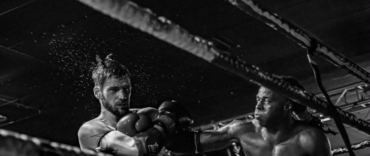 Stacey landing a punch in a Muay Thai fight